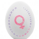 Pink female symbol on white egg isolated on white
